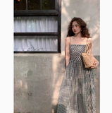 Ndyad and white plaid suspender dress with slim waist and French retro temperament medium-length skirt HZ1024